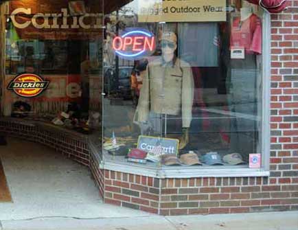 A photo of the right display window at Pauls Clothing and Shoe Store.